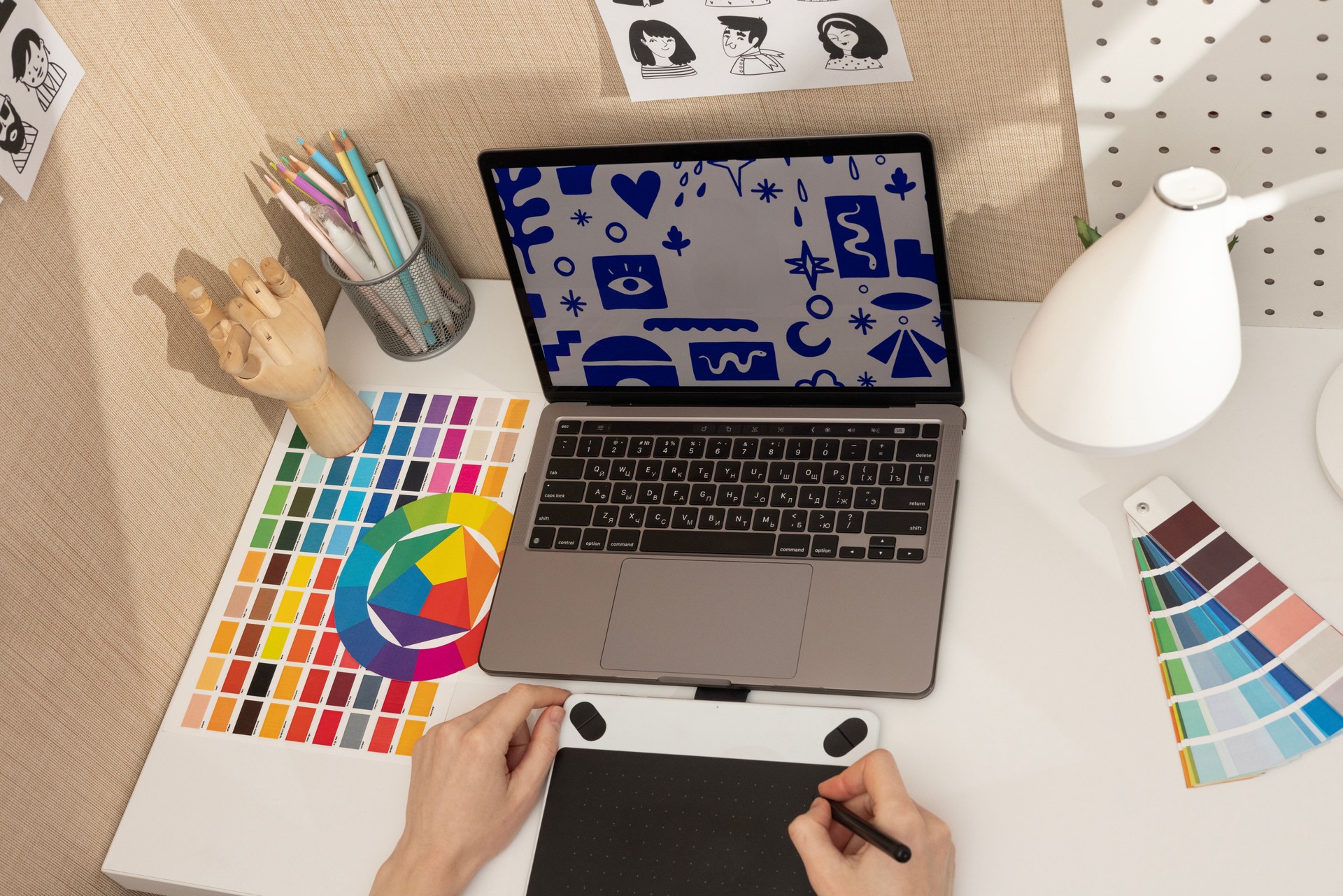 Professional Designer Workspace with Gadgets and Colors